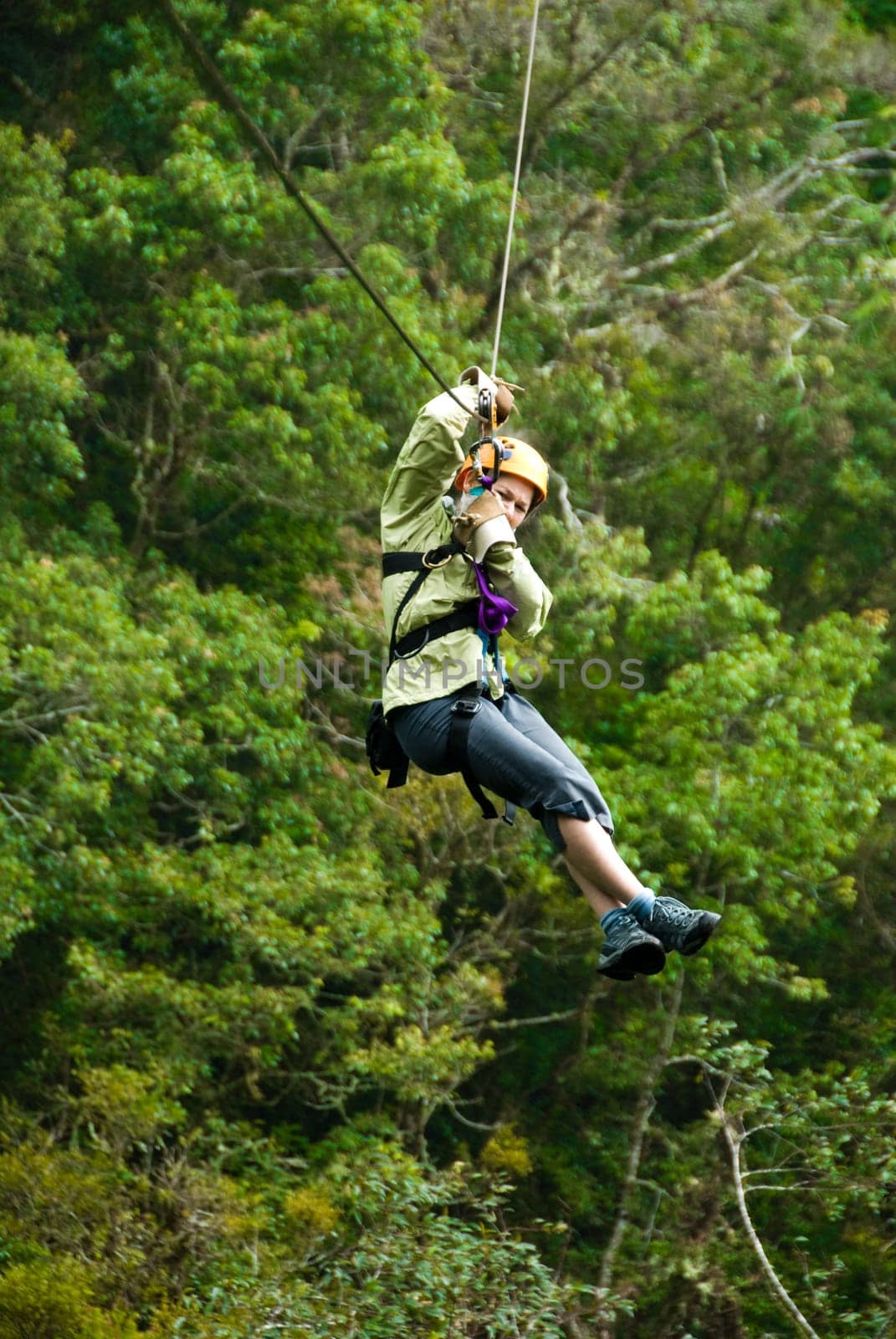 woman on a zip line in panama canopy