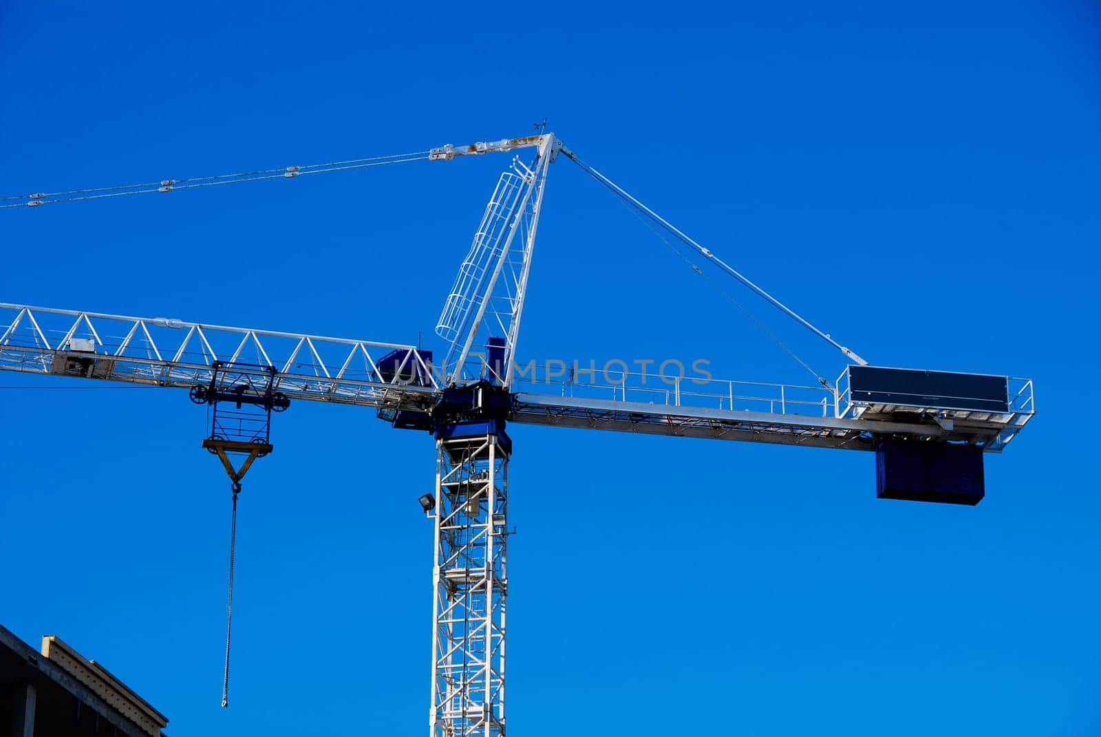 construction site with a white crane on blue sky