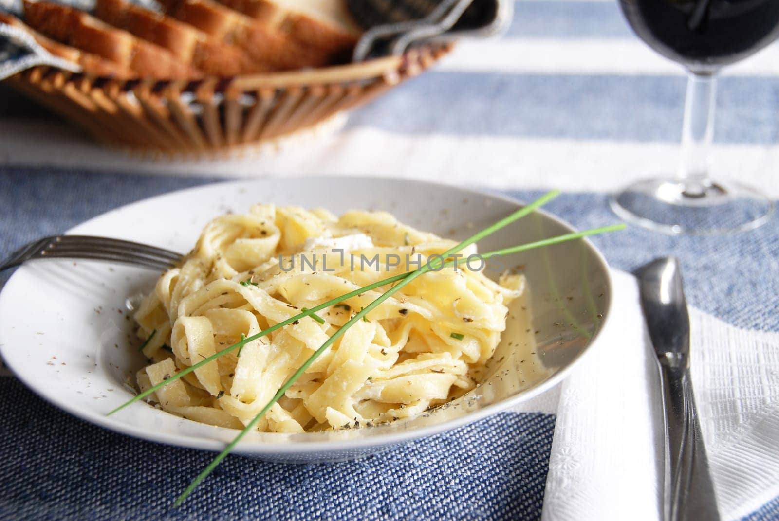 linguini meal with wine
