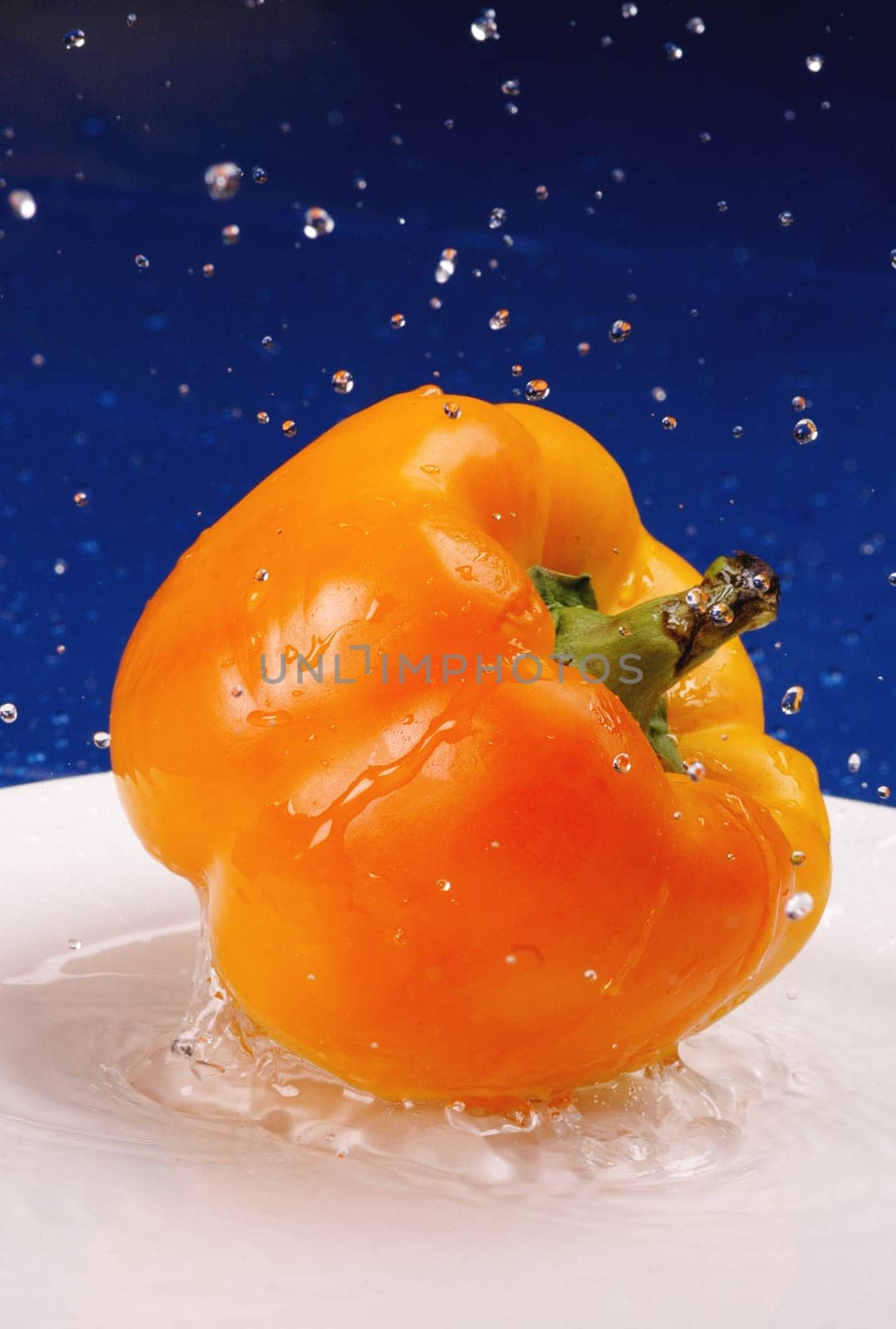 splashing yellow pepper