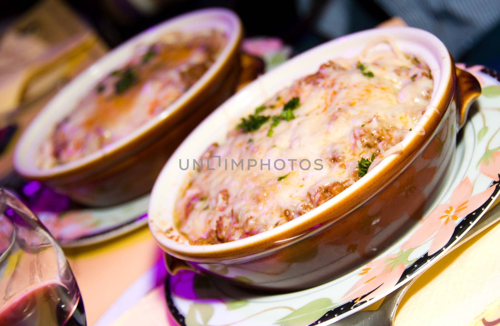 italian spaghetti with melted cheese on top