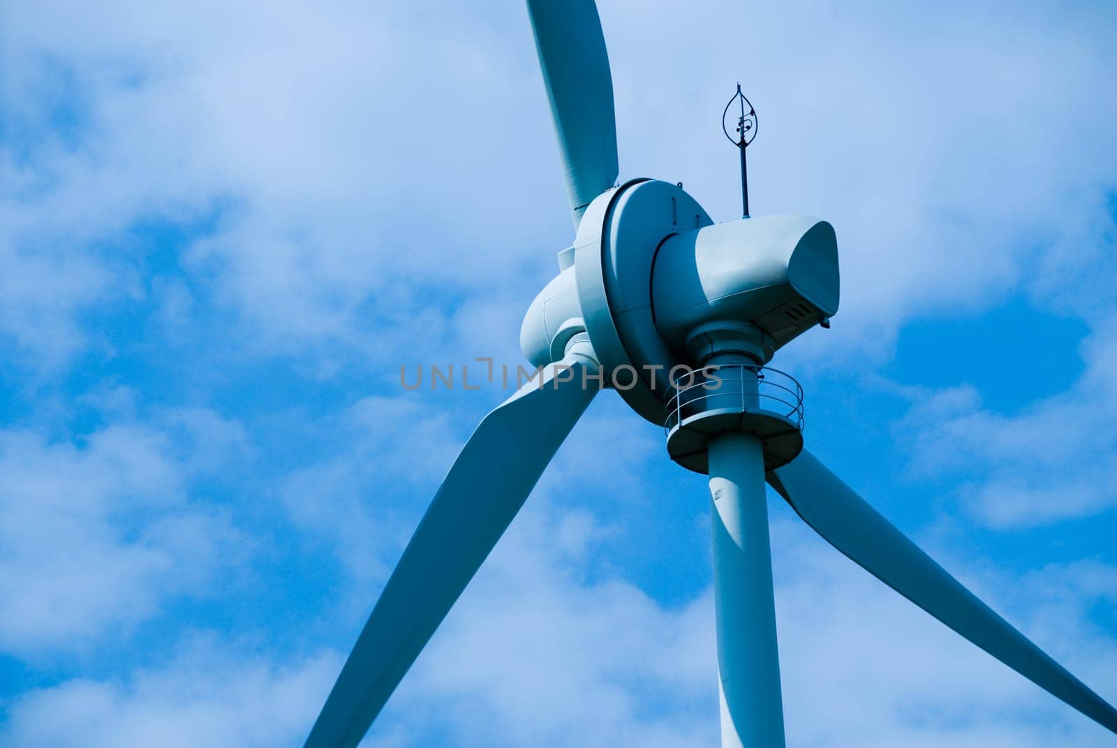 clean energy white wind turbine in the sky