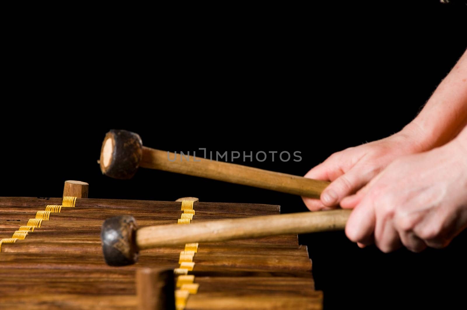 one musician playing xylophone in a studio