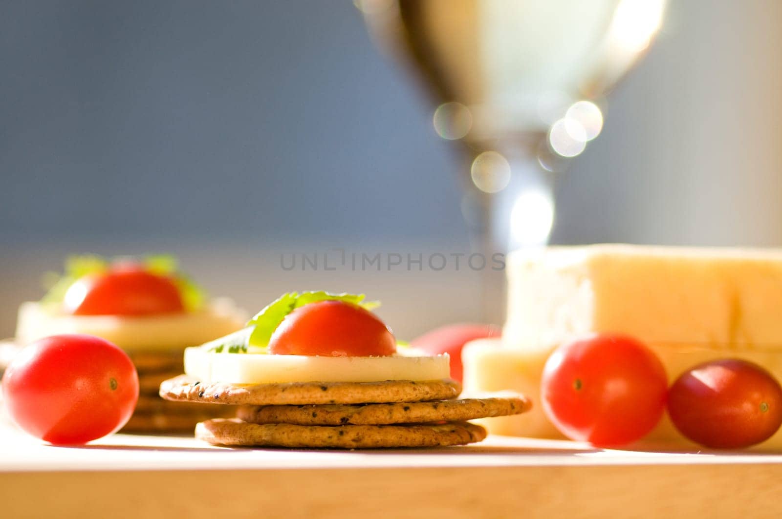 cheese and crackers on a cutting board