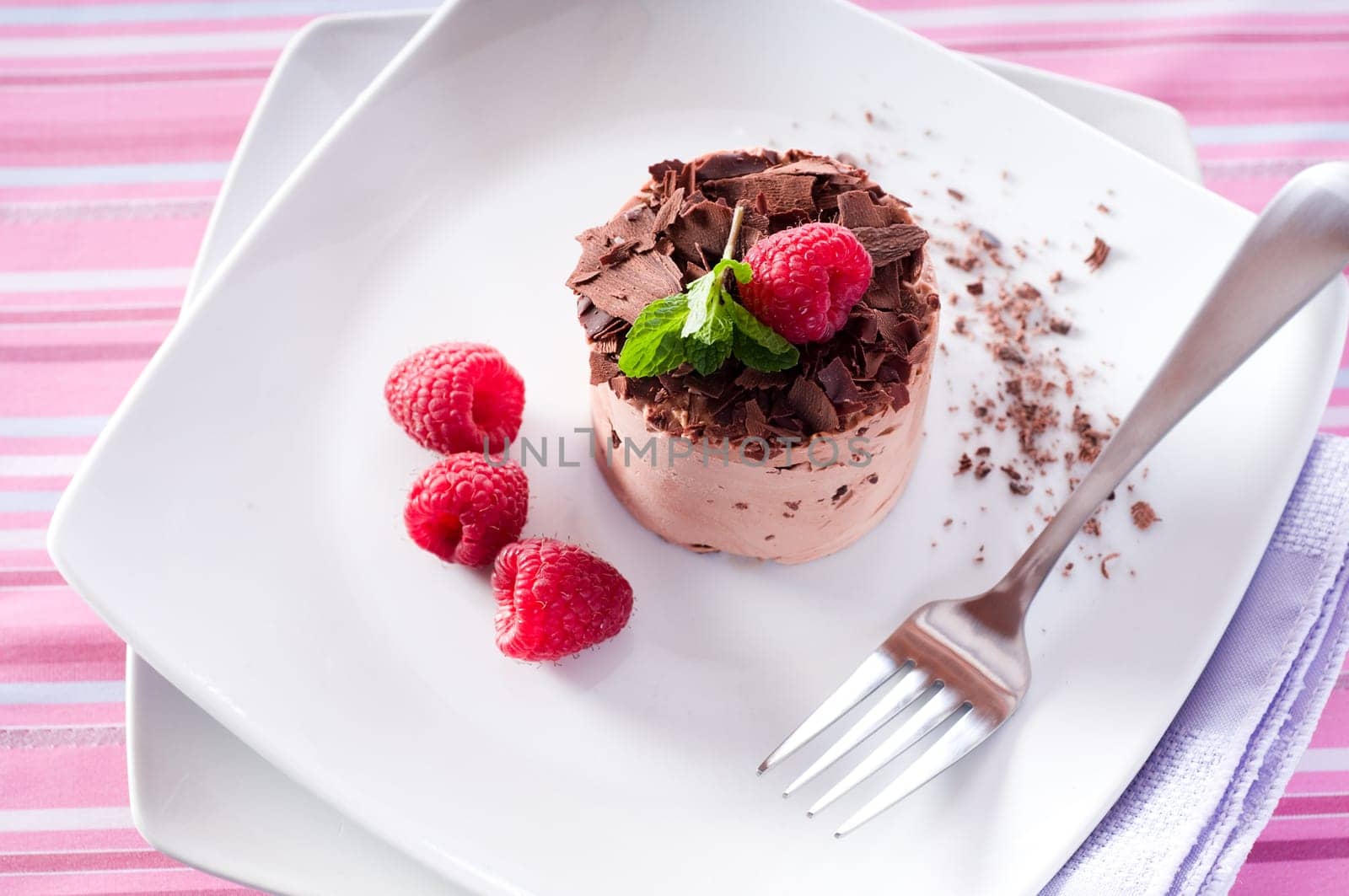 Chocolate Moose dessert on a white plate with milk
