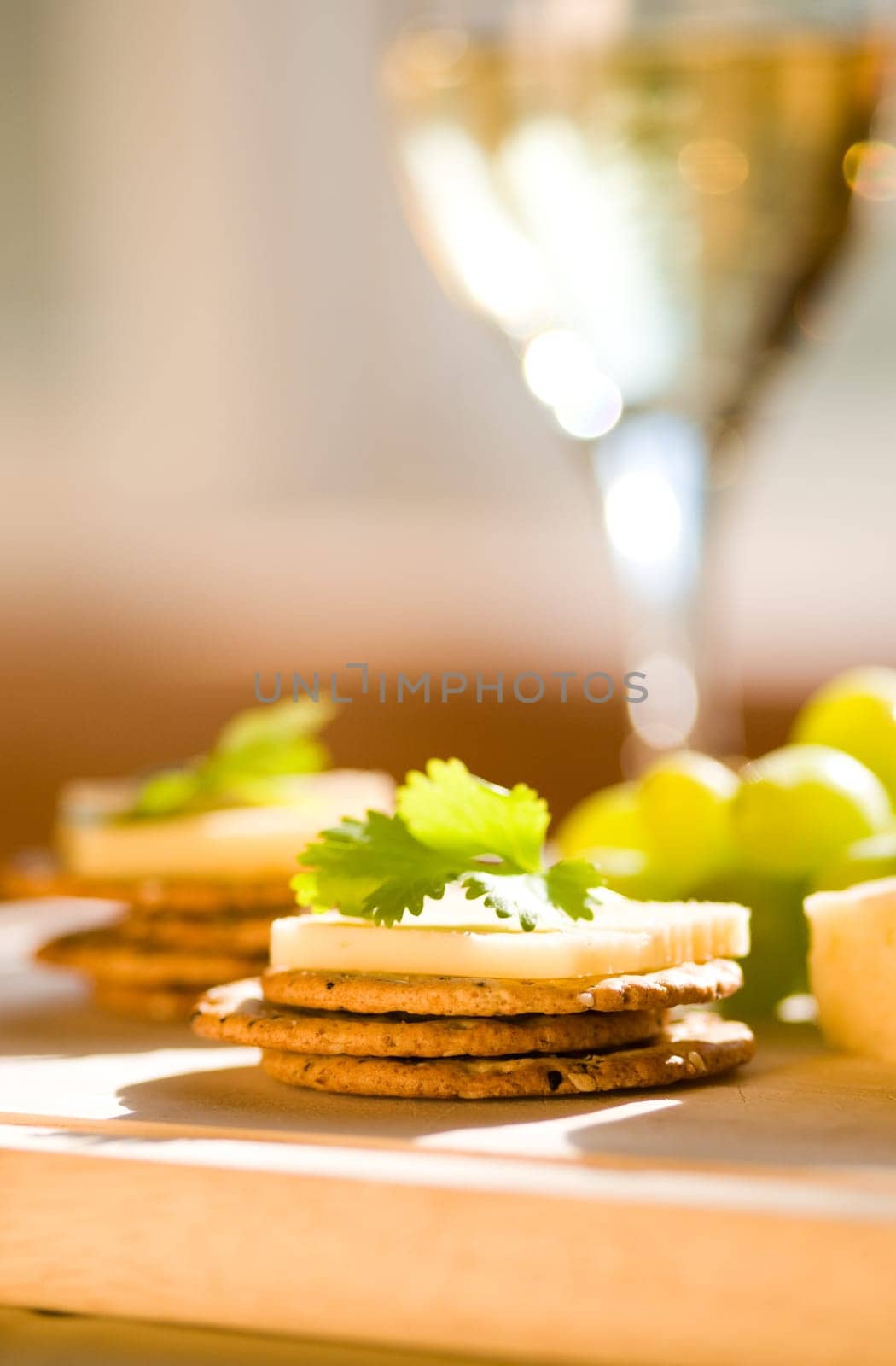 cheese and crackers on a cutting board