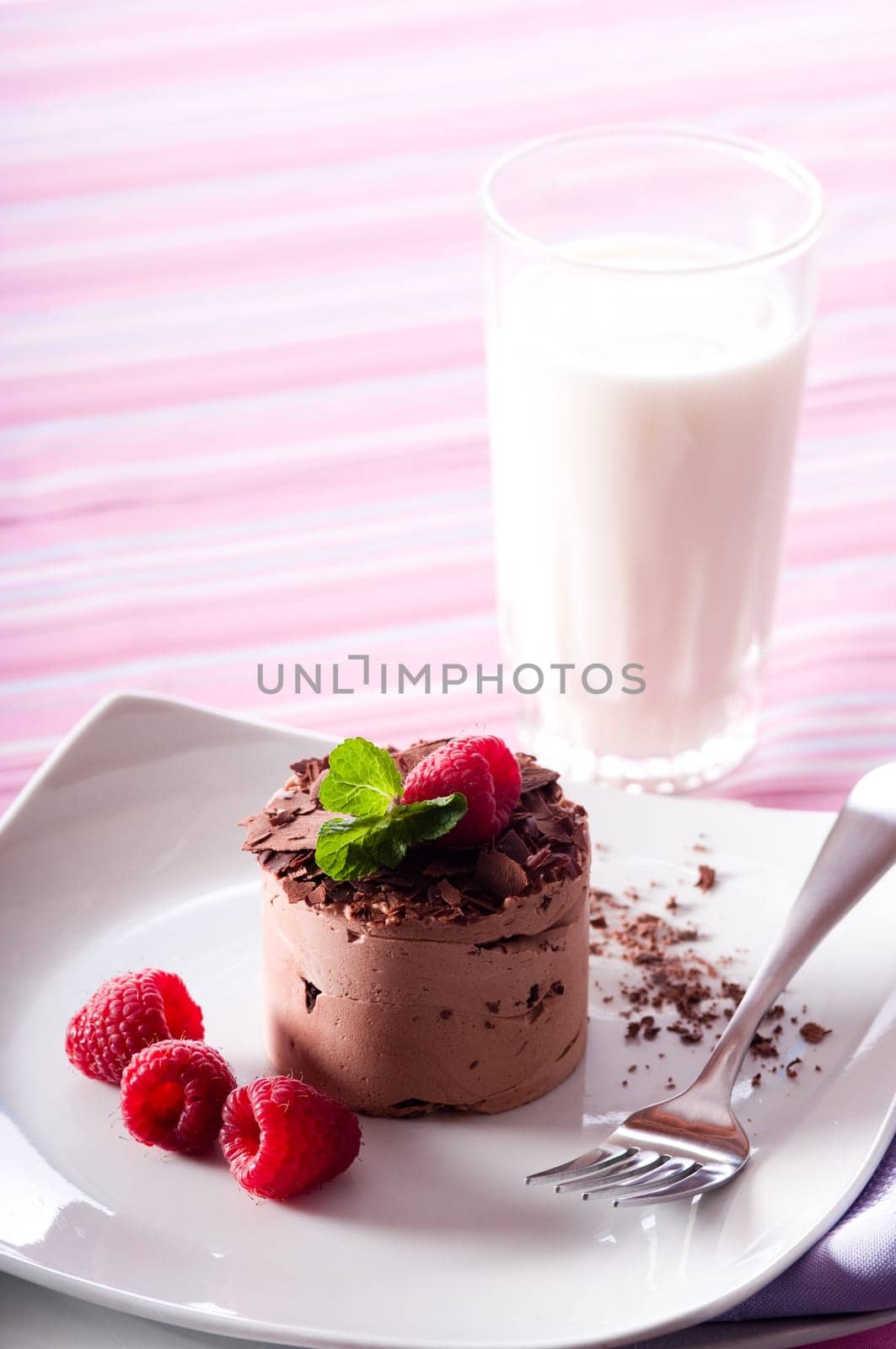 Chocolate Moose dessert on a white plate with milk