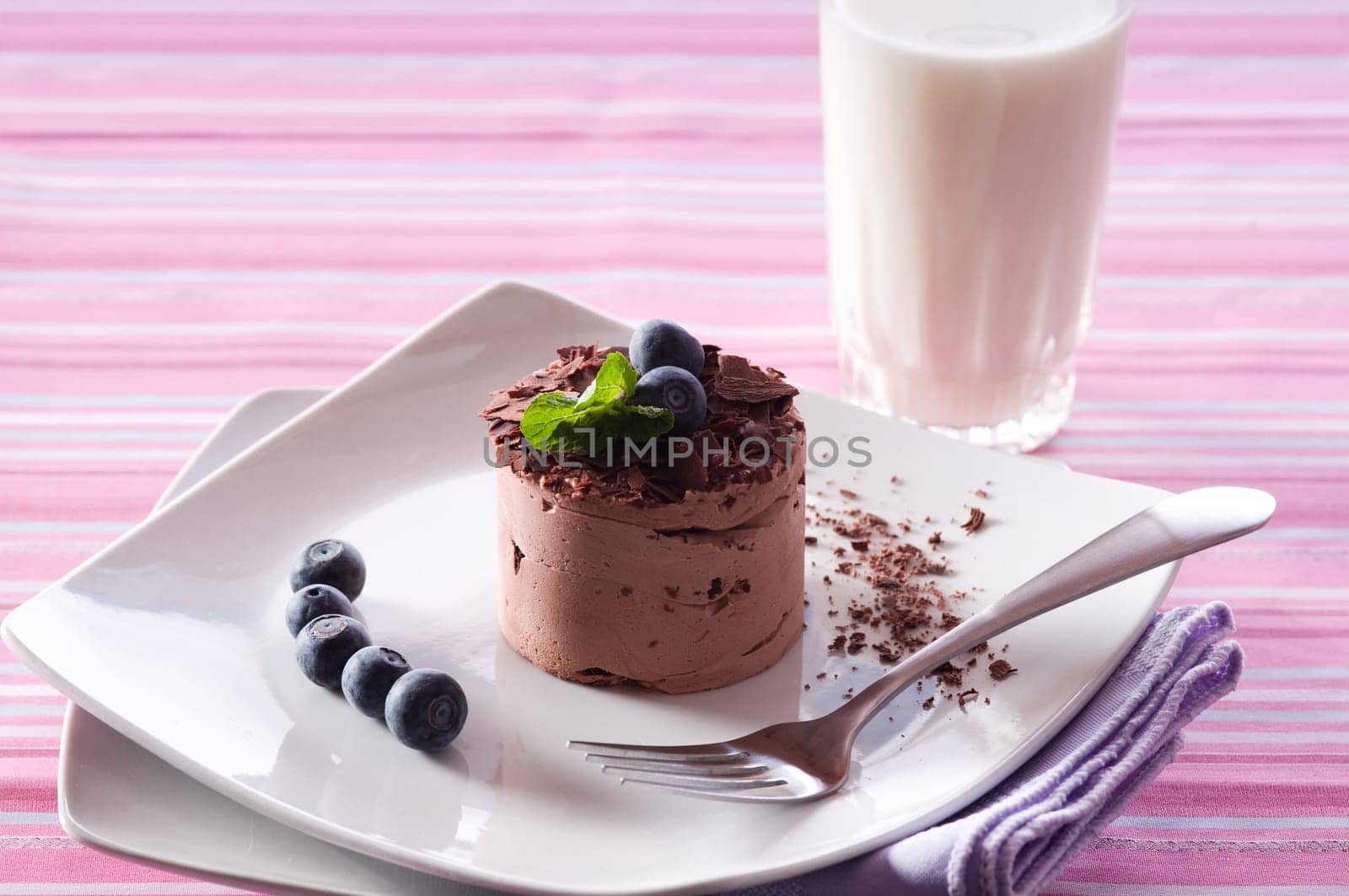 Chocolate Moose dessert on a white plate with milk