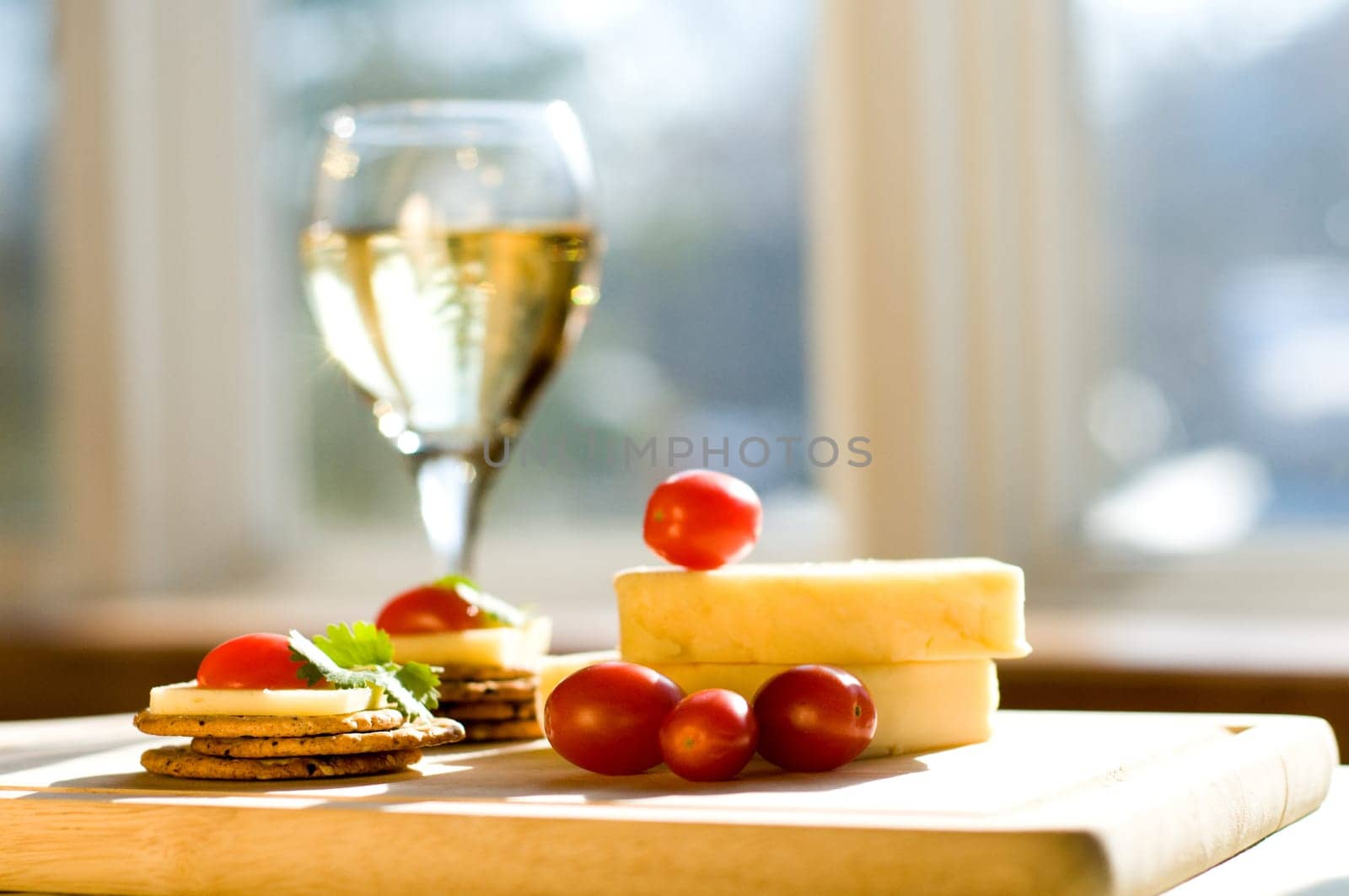 cheese and crackers on a cutting board