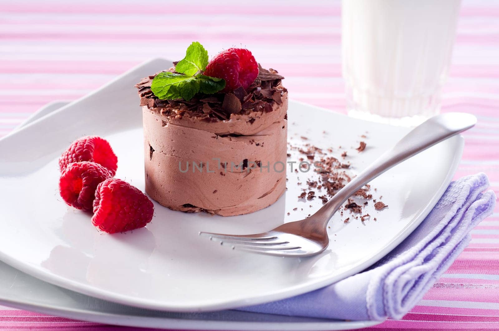 Chocolate Moose dessert on a white plate with milk