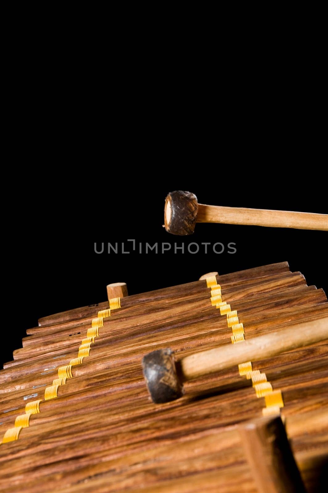 one musician playing xylophone in a studio