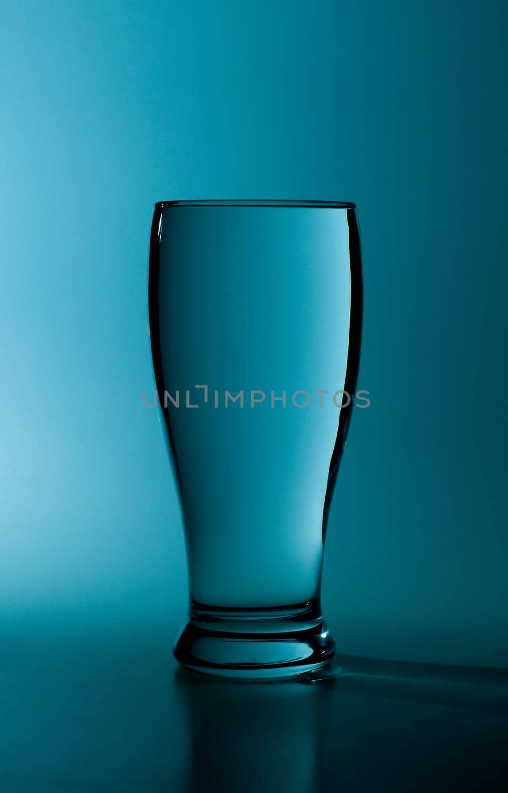 glass of pure water in a blue tone
