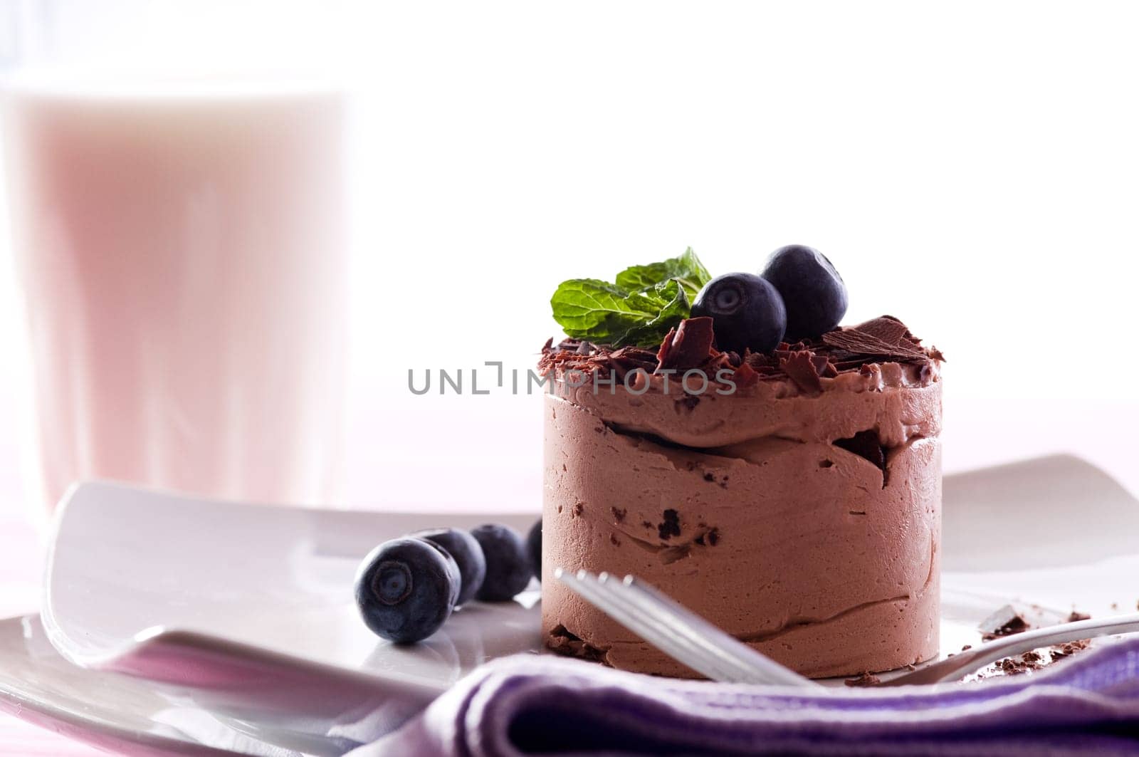 Chocolate Moose dessert on a white plate with milk