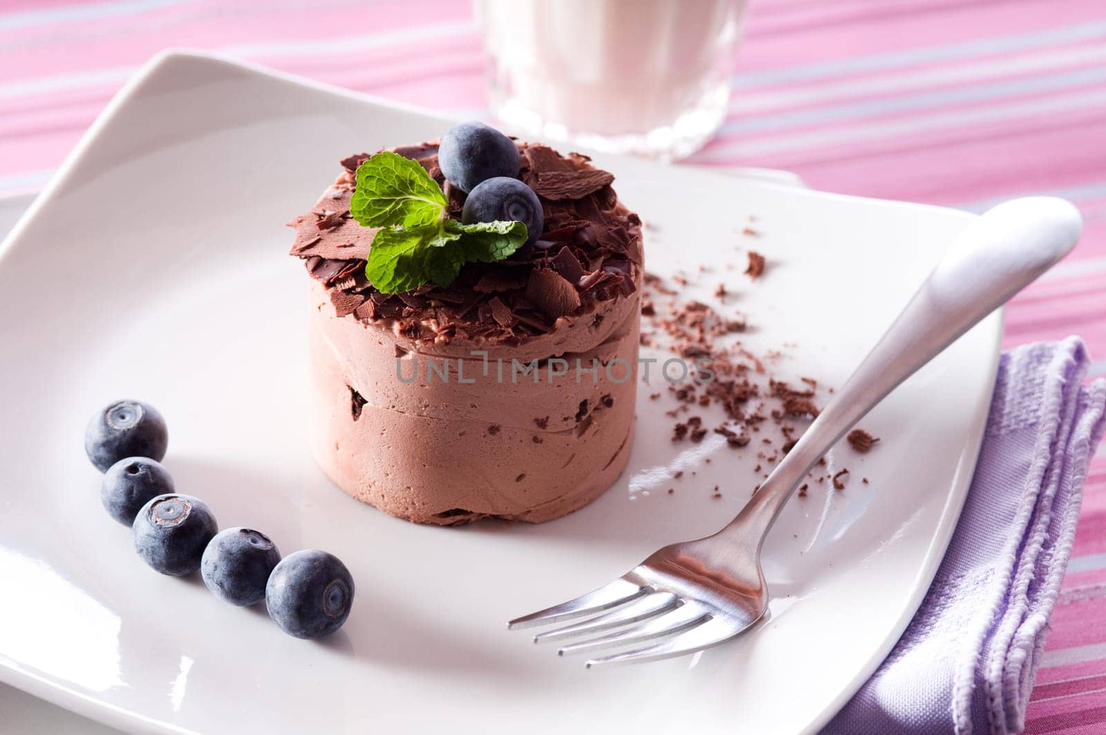 Chocolate Moose dessert on a white plate with milk