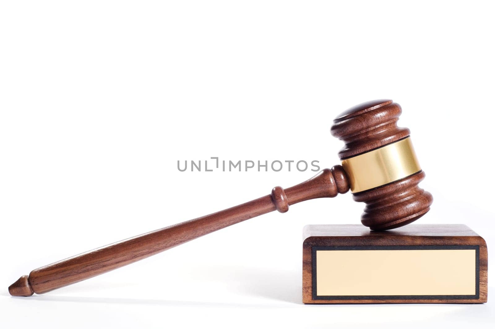 Wooden justice gavel and block with brass