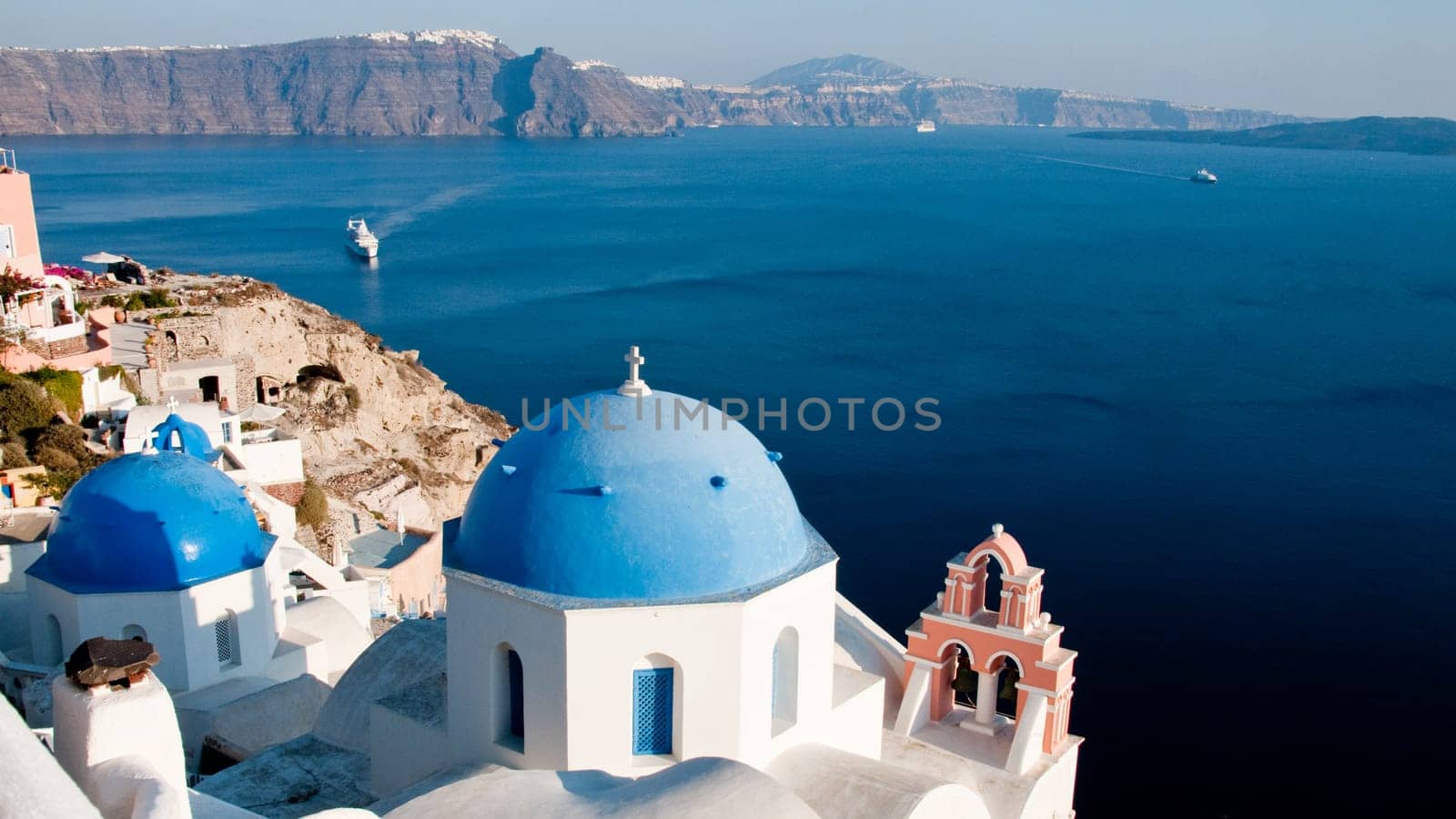 Greek church in santorini greece with a cross