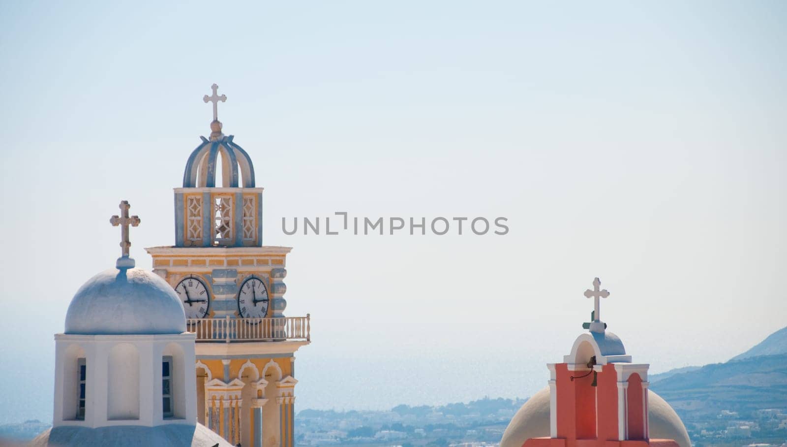 Greek church in santorini greece with a cross