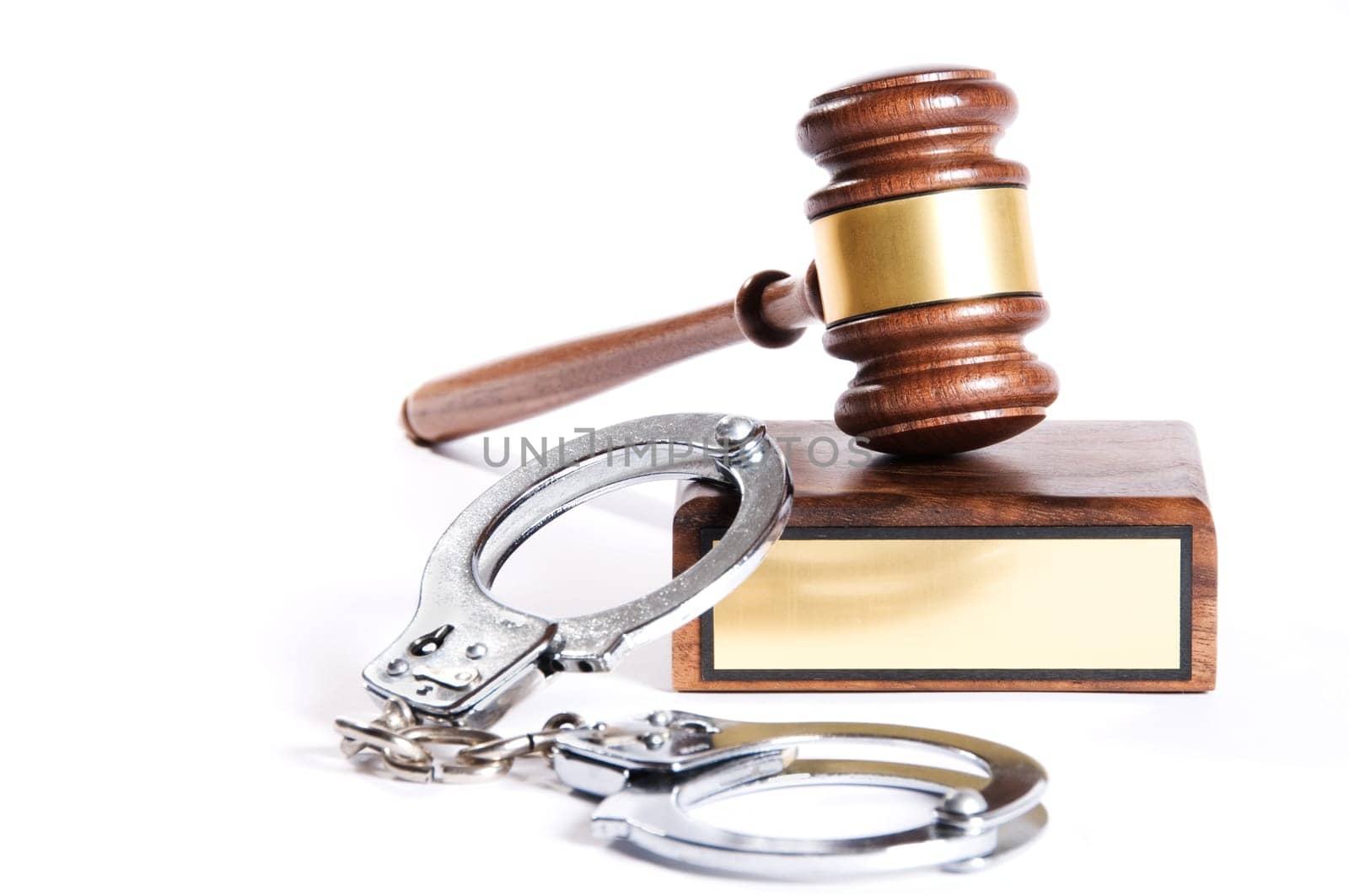 Wooden justice gavel and block with brass