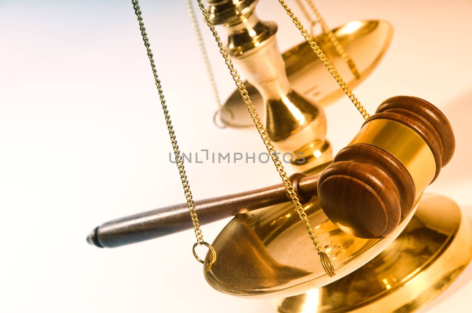 Wooden justice gavel and block with brass
