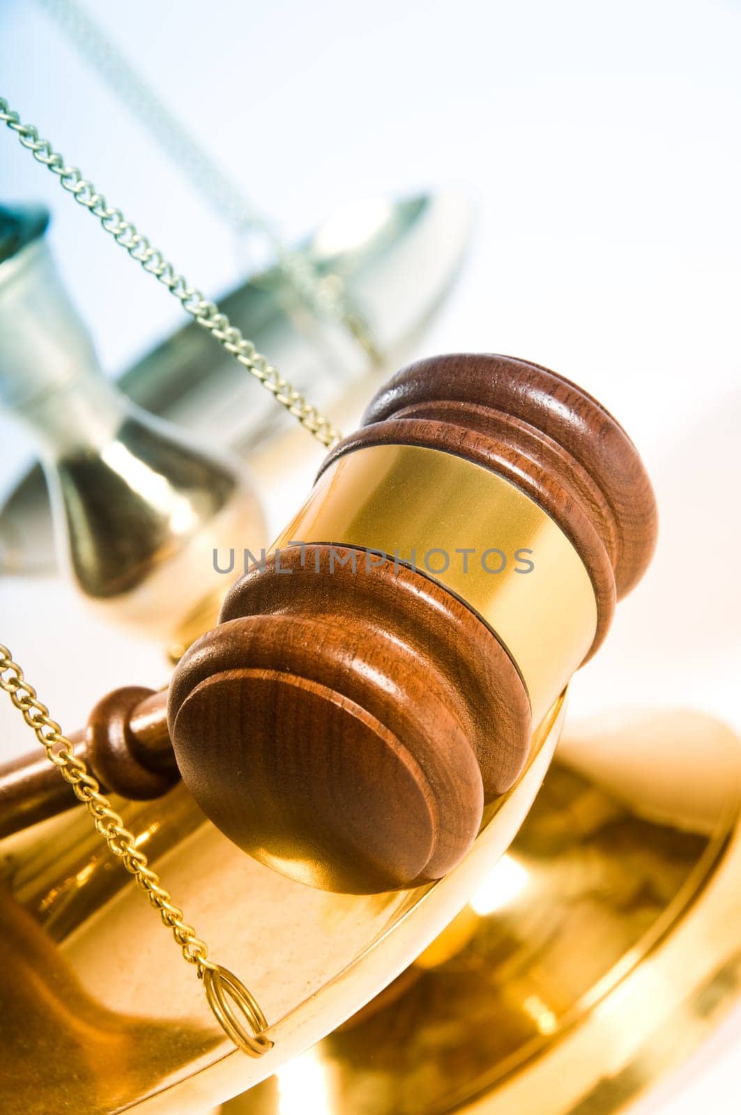 Wooden justice gavel and block with brass