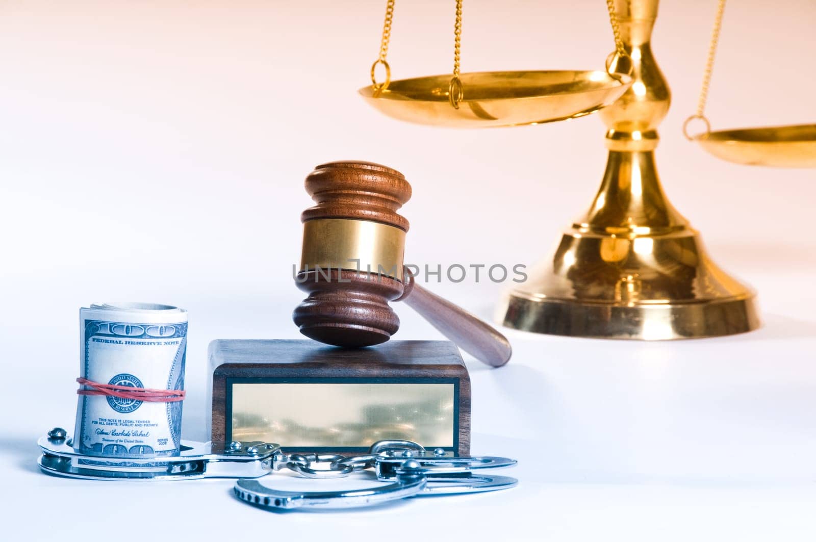 Wooden justice gavel and block with brass