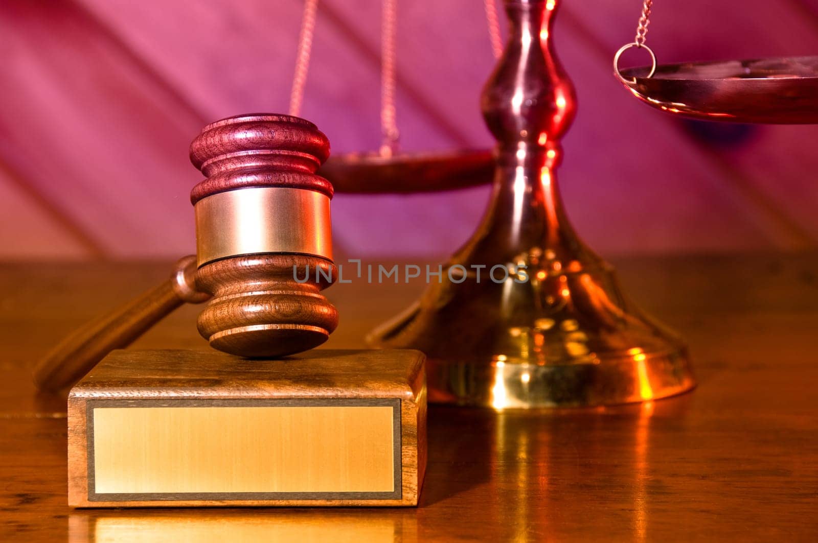 Wooden justice gavel and block with brass