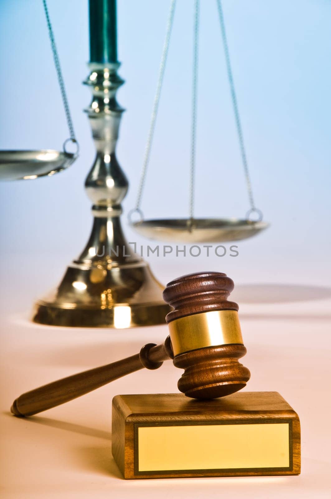 Wooden justice gavel and block with brass