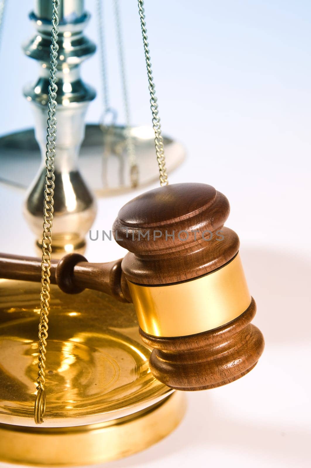 Wooden justice gavel and block with brass