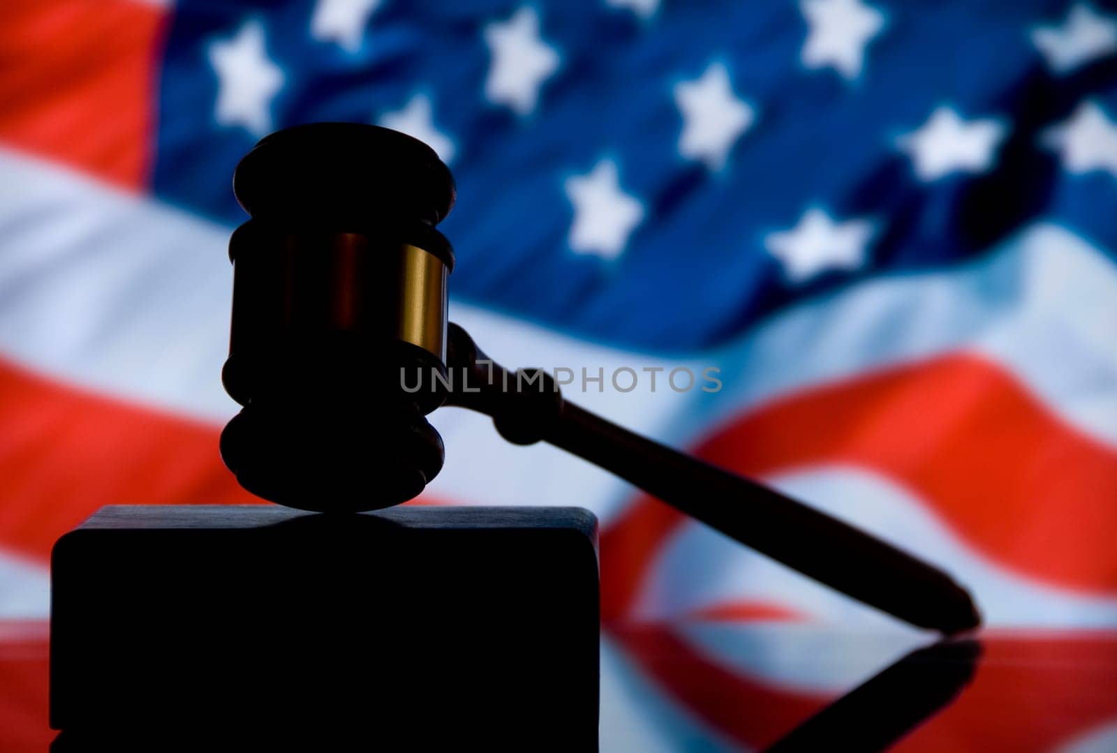 Wooden justice gavel and block with brass