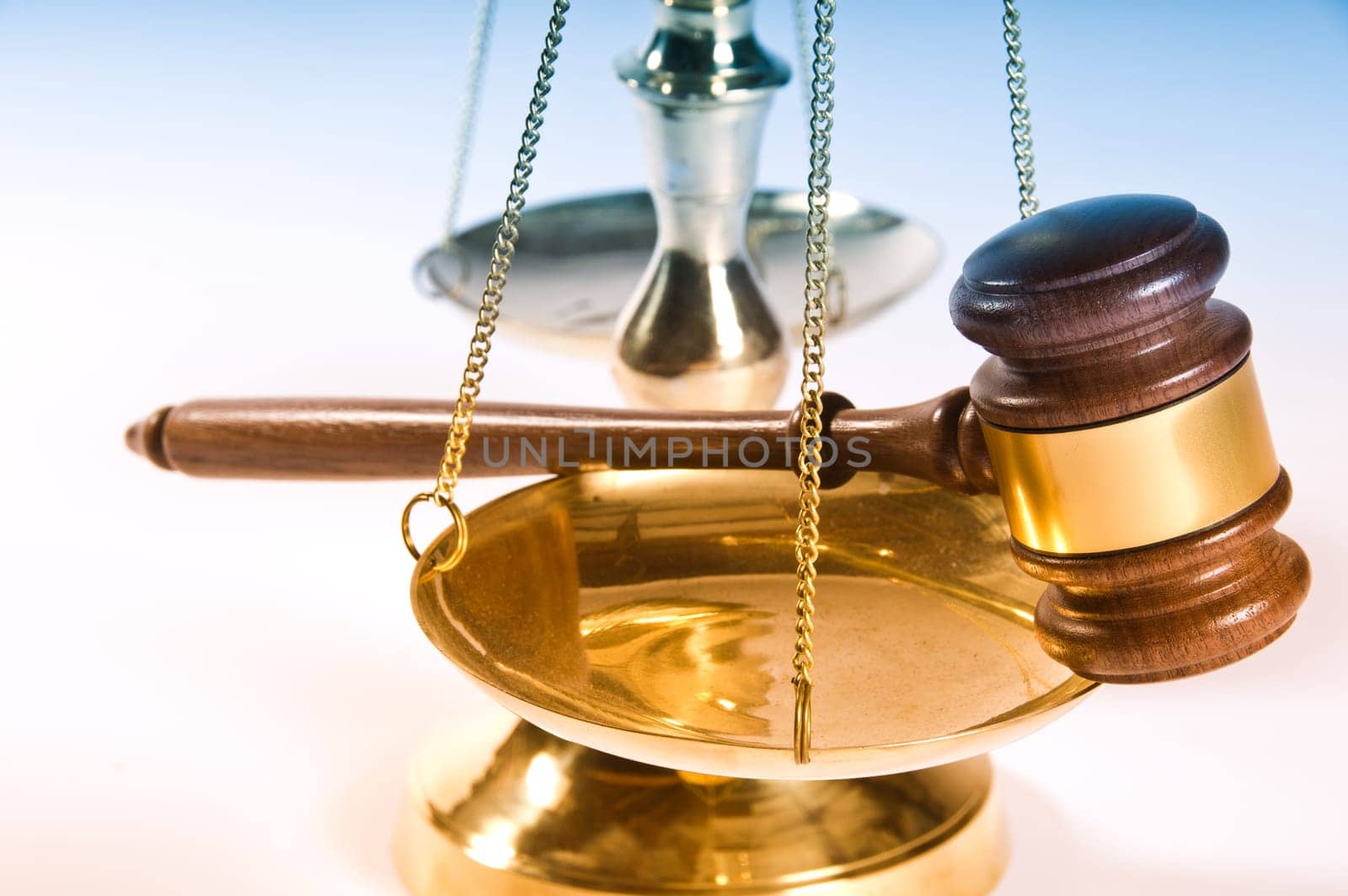 Wooden justice gavel and block with brass