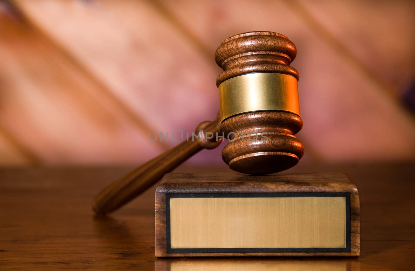 Wooden justice gavel and block with brass