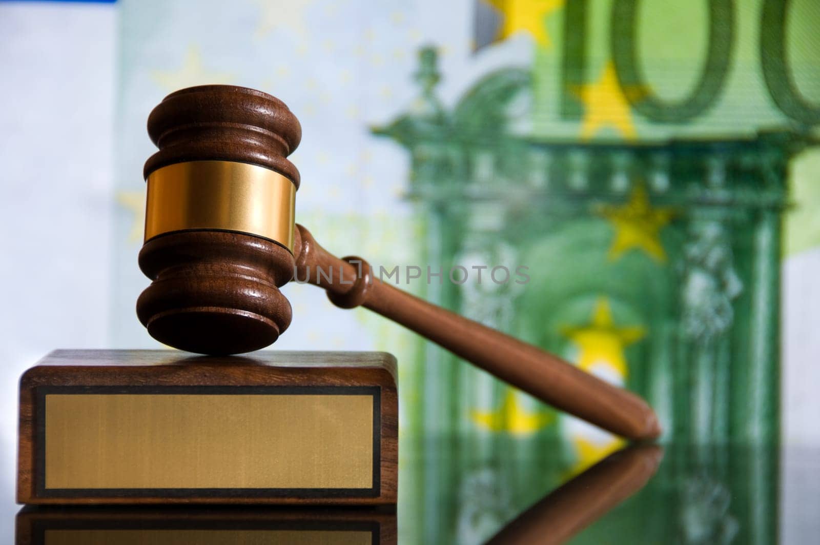 Wooden justice gavel and block with brass