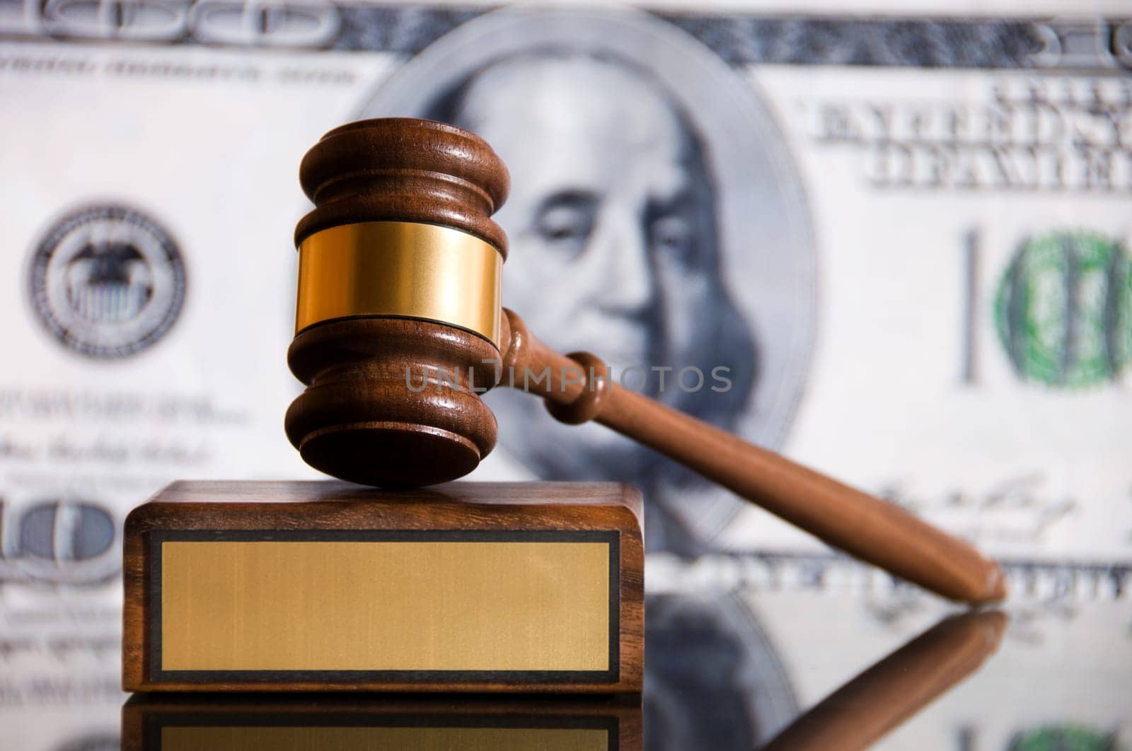 Wooden justice gavel and block with brass