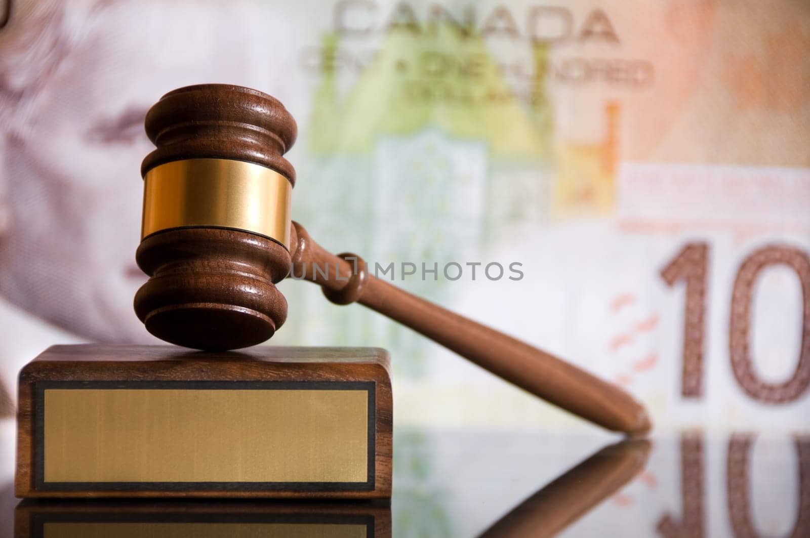 Wooden justice gavel and block with brass
