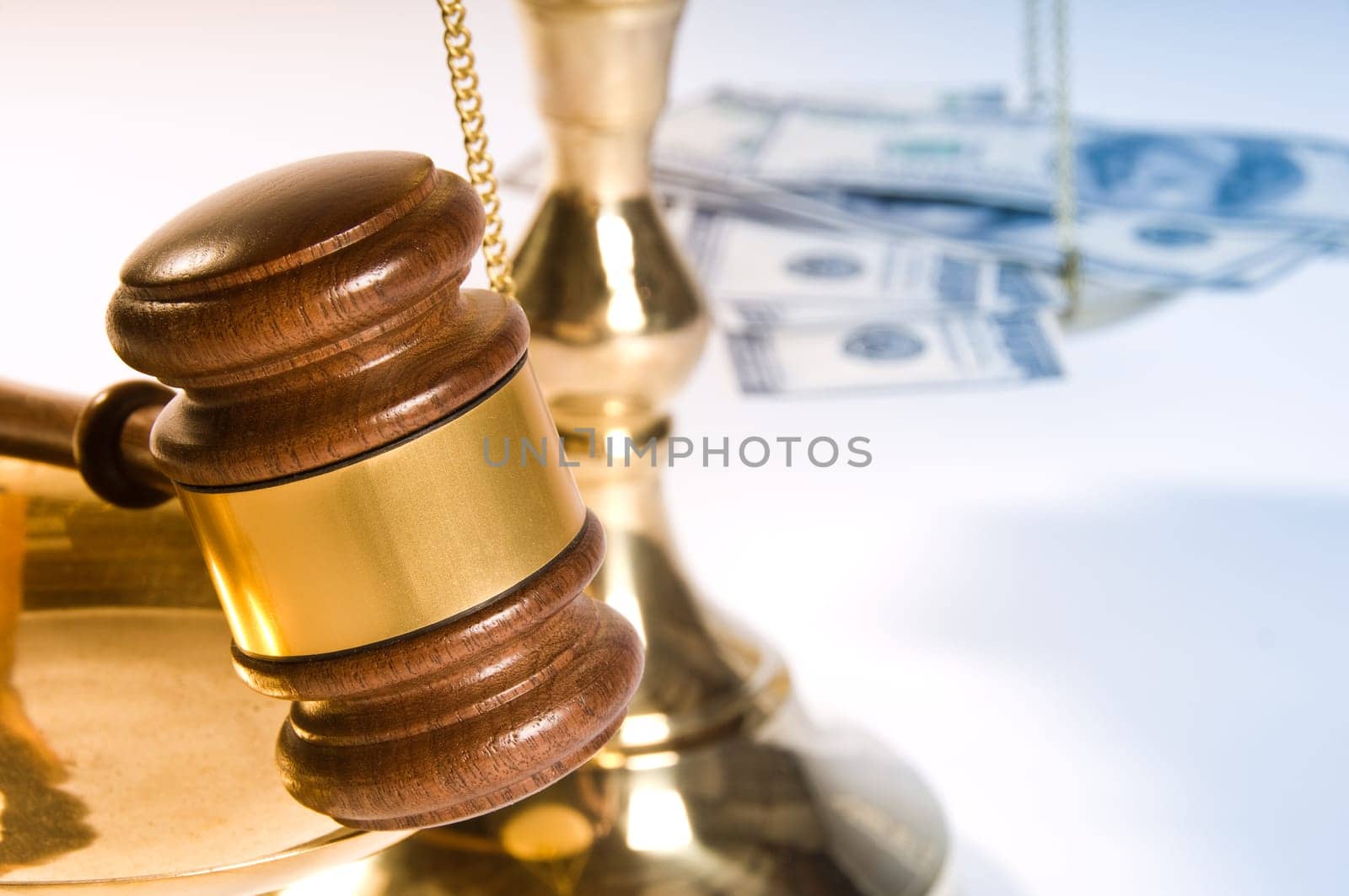Wooden justice gavel and block with brass