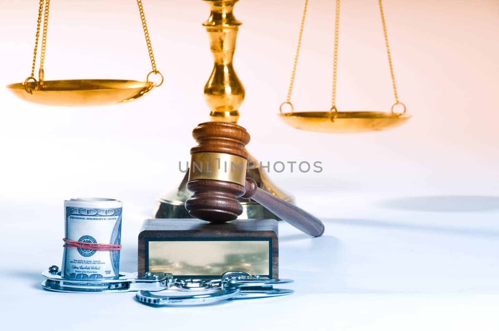Wooden justice gavel and block with brass