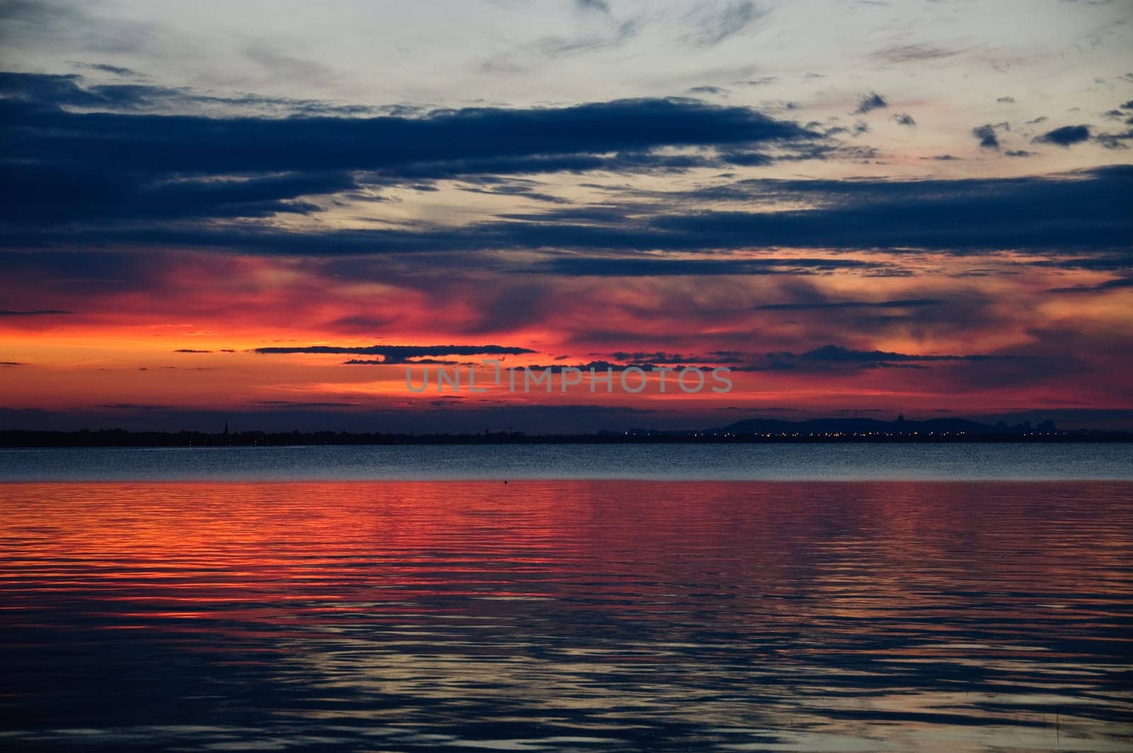 watching a sunset on the calm water