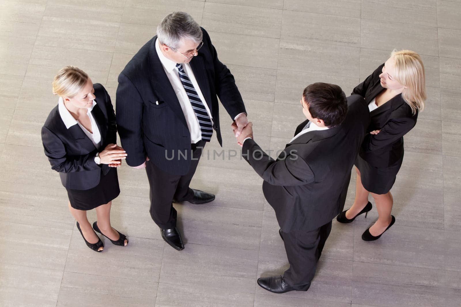 Representatives of two companies shaking hands