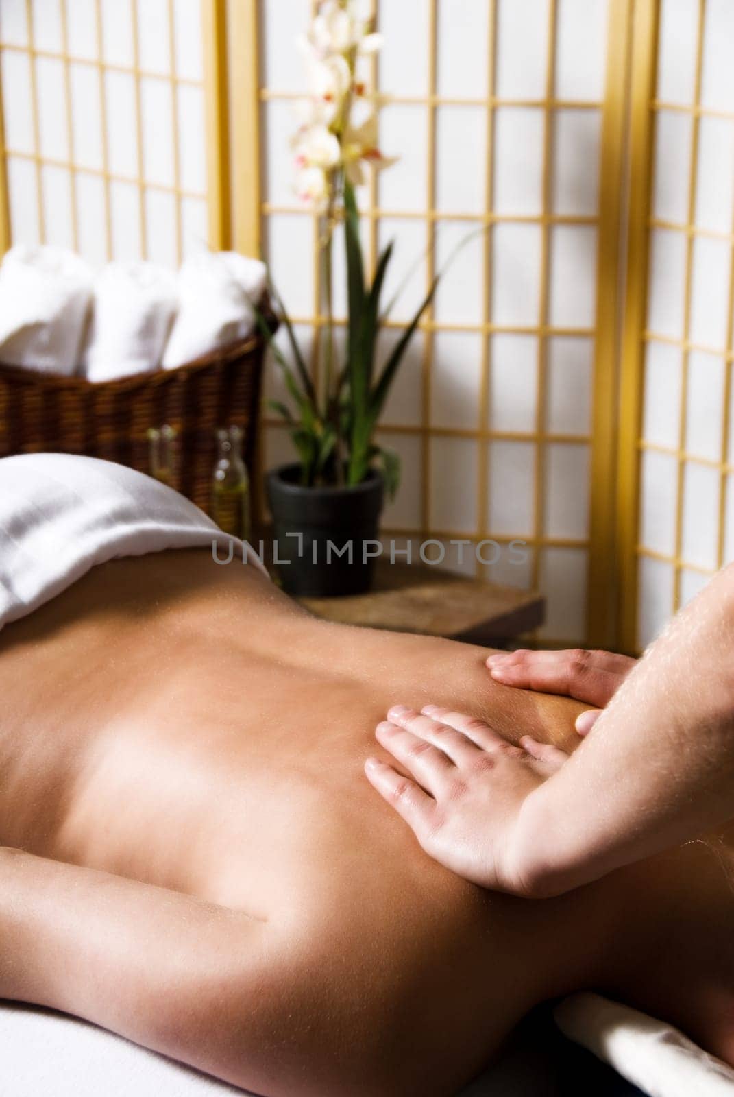 woman getting a good massage at a day spa