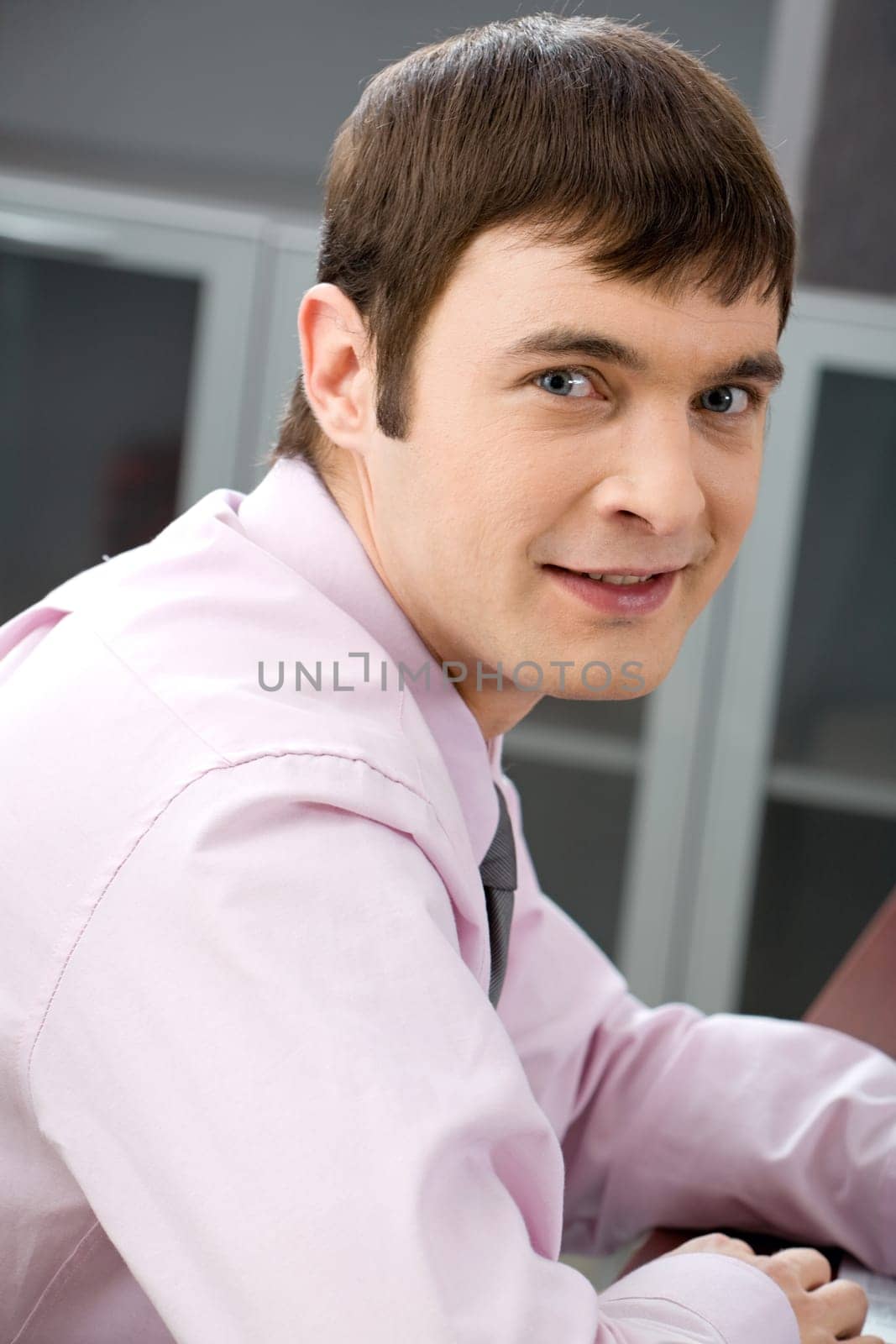 Portrait of confident smiling manager looking at camera
