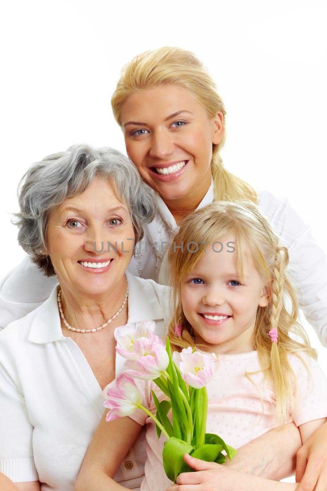 Portrait of happy female relatives looking at camera