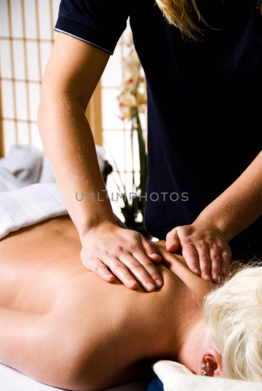 woman getting a good massage at a day spa