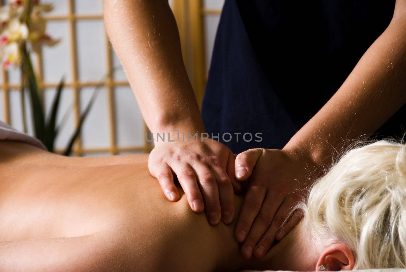 woman getting a good massage at a day spa