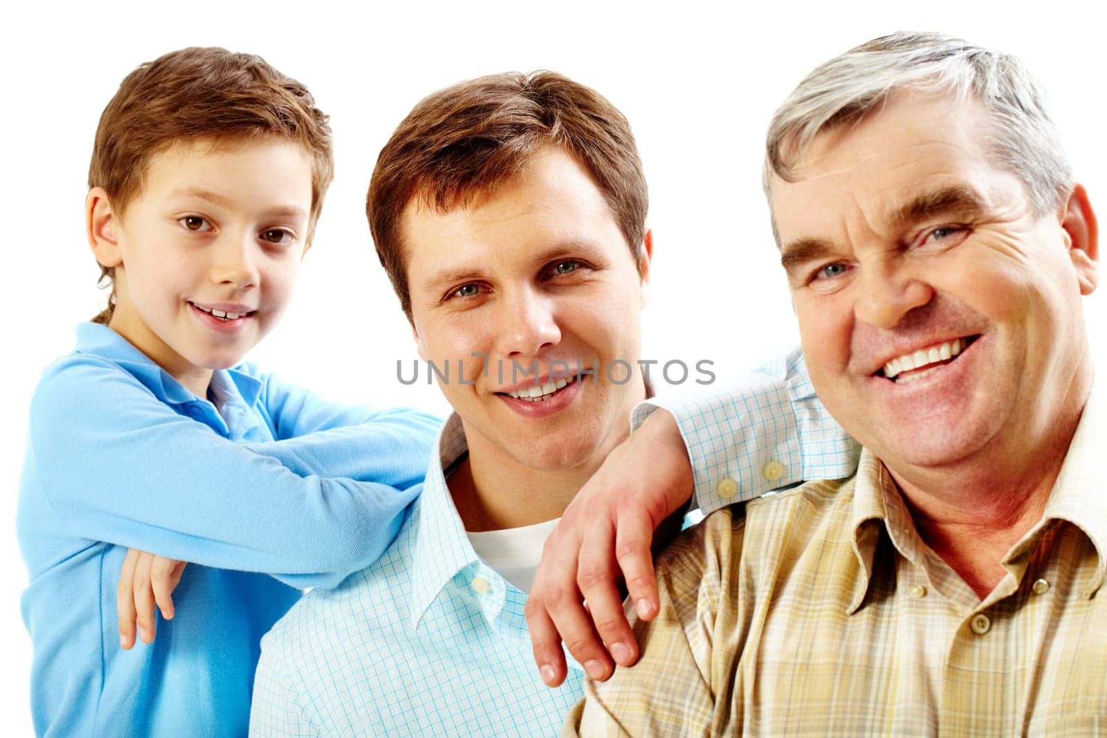 Portrait of a father, grandfather and son looking at camera