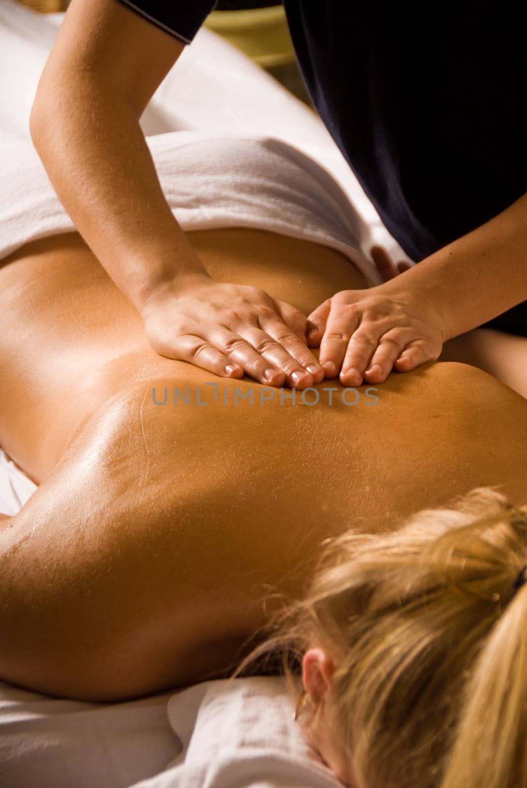 woman at a day spa getting a relaxation massage
