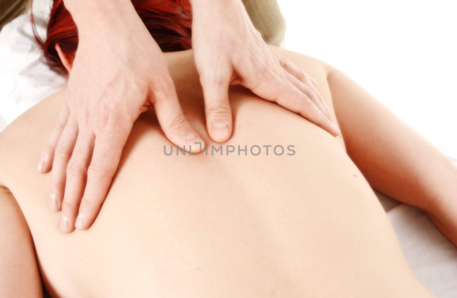 woman in a spa getting a back massage