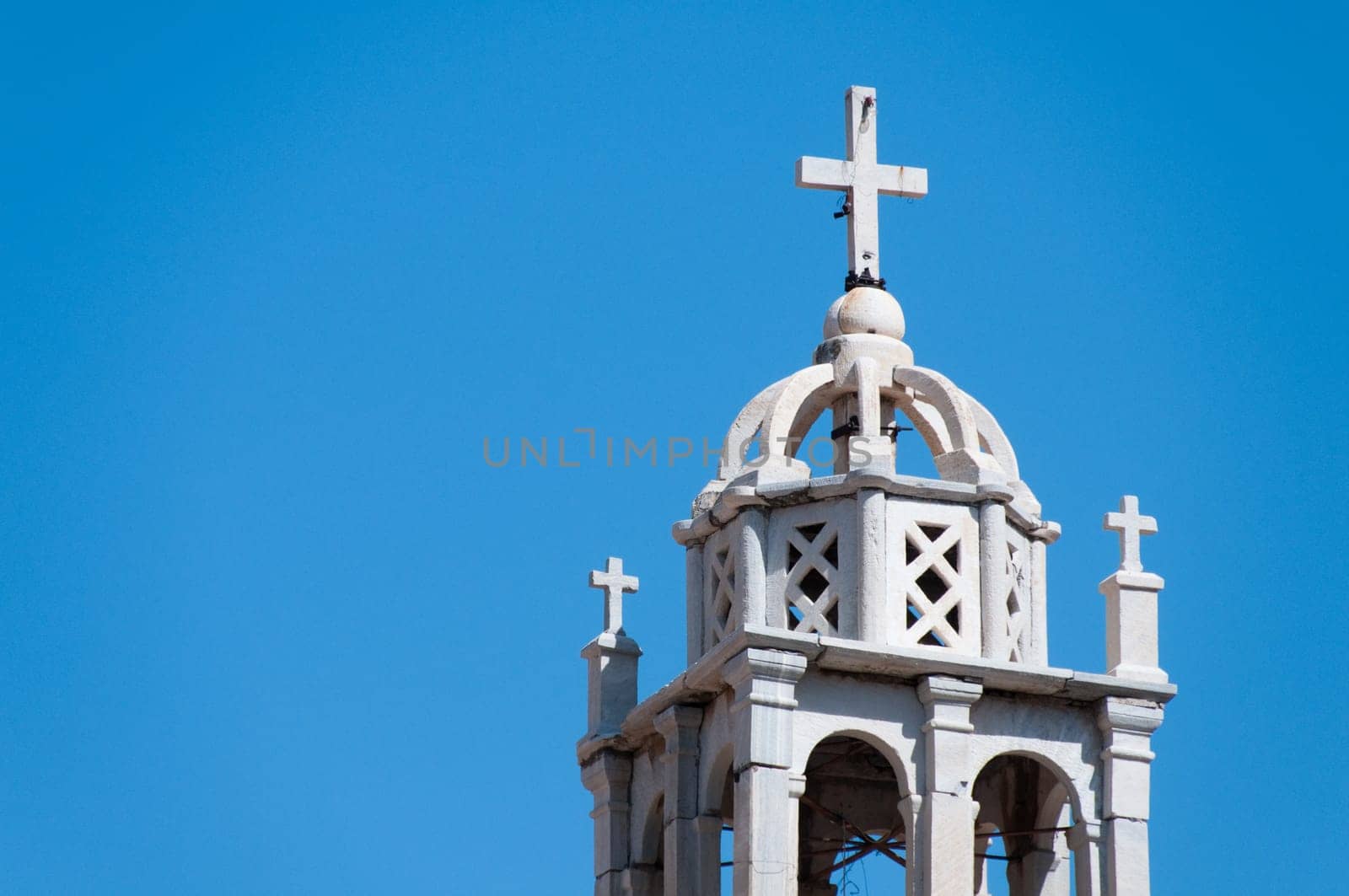 Greek church in santorini greece with a cross