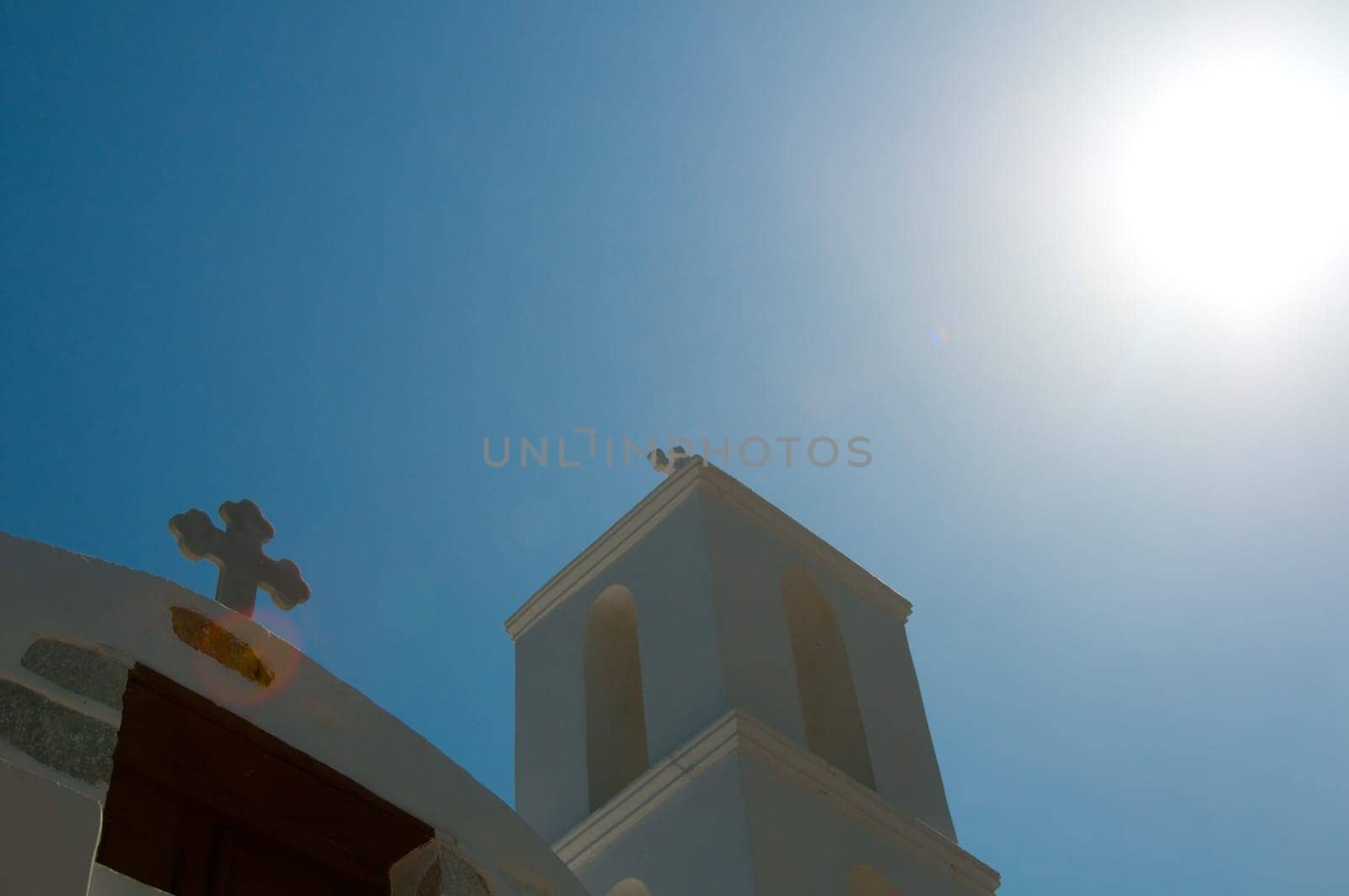 Greek church in santorini greece with a cross