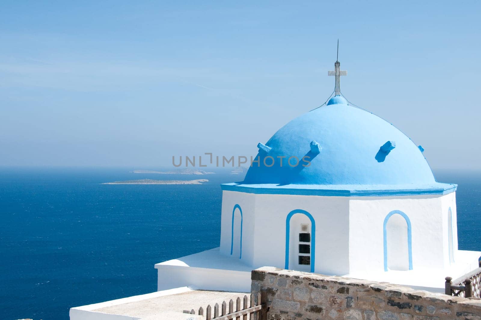 Greek church in santorini greece with a cross