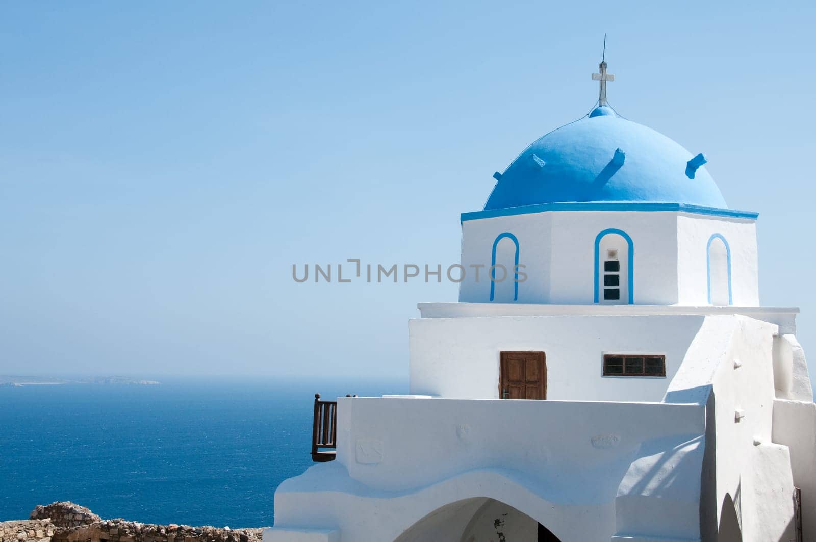 Greek church in santorini greece with a cross